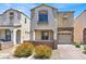 Inviting two-story home featuring a neutral color scheme, low-maintenance landscaping, and attached one-car garage at 10230 Viterbo St, Las Vegas, NV 89183