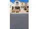 Charming two-story townhome with desert landscaping and an attached one car garage at 10230 Viterbo St, Las Vegas, NV 89183