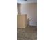 Hallway with carpeted floors and a partial view of a staircase at 10230 Viterbo St, Las Vegas, NV 89183