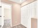 Hallway features a large closet, neutral walls, and carpet flooring at 10230 Viterbo St, Las Vegas, NV 89183