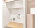 Laundry closet includes hookups, storage, and a single shelf at 10230 Viterbo St, Las Vegas, NV 89183
