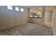 Inviting living room features neutral tones and a seamless flow into the open-concept kitchen at 10230 Viterbo St, Las Vegas, NV 89183