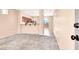Living room featuring new gray carpeting and an open layout at 10230 Viterbo St, Las Vegas, NV 89183