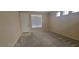 Inviting living room with plush carpeting and a neutral palette perfect for relaxation and entertaining at 10230 Viterbo St, Las Vegas, NV 89183