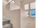 Staircase leading to upper floor with multiple windows at 10230 Viterbo St, Las Vegas, NV 89183