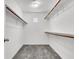 Walk-in closet with built in shelving and carpet at 10230 Viterbo St, Las Vegas, NV 89183