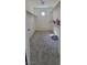 Spacious walk-in closet featuring gray carpeting and shelving at 10230 Viterbo St, Las Vegas, NV 89183