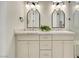 Bathroom with double vanity, marble countertop, and modern lighting fixtures at 10277 Roma Madre Ave, Las Vegas, NV 89135