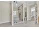 Large glass shower is a feature of this large bathroom at 10277 Roma Madre Ave, Las Vegas, NV 89135