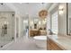 Expansive bathroom layout showcasing a walk-in shower and dual vanities at 10277 Roma Madre Ave, Las Vegas, NV 89135