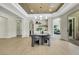 Open dining area boasts a modern light fixture, and transitions to the outdoor living space at 10277 Roma Madre Ave, Las Vegas, NV 89135