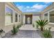 Inviting front entrance featuring decorative landscaping and a brick walkway to the front door at 10277 Roma Madre Ave, Las Vegas, NV 89135