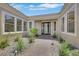 Inviting front entrance featuring decorative landscaping and a brick walkway to the front door at 10277 Roma Madre Ave, Las Vegas, NV 89135