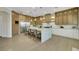 Open kitchen features a large island, built-in stainless steel appliances, and ample counter space at 10277 Roma Madre Ave, Las Vegas, NV 89135