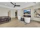 Spacious main bedroom with a fireplace, TV, modern furniture, and access to the pool area at 10277 Roma Madre Ave, Las Vegas, NV 89135