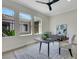 Office with natural light, sleek decor, stylish ceiling fan, and modern furniture at 10277 Roma Madre Ave, Las Vegas, NV 89135