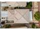Birds eye view of a home with desert landscaping, a tiled roof, and a covered patio at 10440 Bay Ginger Ln, Las Vegas, NV 89135