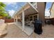 Landscaped backyard with a covered patio and desert landscape, great for outdoor living and entertaining at 10440 Bay Ginger Ln, Las Vegas, NV 89135