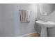 A half bath featuring a pedestal sink and a decorative hand towel at 10440 Bay Ginger Ln, Las Vegas, NV 89135