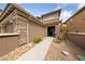 Inviting walkway leading to home's front door, surrounded by desert landscaping and rock ground cover at 10440 Bay Ginger Ln, Las Vegas, NV 89135