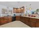 Kitchen with modern appliances, wood cabinets, and granite countertops at 10440 Bay Ginger Ln, Las Vegas, NV 89135