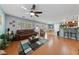 Bright and airy living room showing hardwood floors, large windows, and an open concept design at 10440 Bay Ginger Ln, Las Vegas, NV 89135