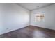Bedroom boasts natural light, wood-look floors, base-trim and neutral paint at 10458 Gabaldon St, Las Vegas, NV 89141