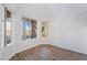 Corner bedroom with large windows offering views of the neighborhood and stylish wood-look floors at 10458 Gabaldon St, Las Vegas, NV 89141