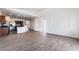 Open-concept space featuring living room and kitchen areas with modern flooring and finishes at 10458 Gabaldon St, Las Vegas, NV 89141