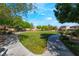 A community park with green grass, paved walkways, trees, and serene outdoor recreational space at 10458 Gabaldon St, Las Vegas, NV 89141