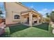 Exterior: Covered patio and landscaped backyard at 10948 Carberry Hill St, Las Vegas, NV 89141