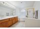 Bright bathroom with double sink vanity, large soaking tub and separate shower at 10948 Carberry Hill St, Las Vegas, NV 89141