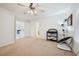 Bright, carpeted bedroom featuring a ceiling fan, neutral walls and ample natural light at 10948 Carberry Hill St, Las Vegas, NV 89141