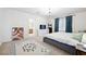 Large bedroom with chandelier, neutral carpet, and ensuite bath at 10948 Carberry Hill St, Las Vegas, NV 89141