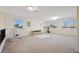 Large bonus room with multiple windows and carpeted floor at 10948 Carberry Hill St, Las Vegas, NV 89141