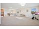 Spacious bonus room with neutral carpet, natural light, and staircase access at 10948 Carberry Hill St, Las Vegas, NV 89141