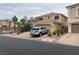 A well-maintained two-story home featuring a tile roof and manicured landscaping at 10948 Carberry Hill St, Las Vegas, NV 89141