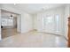 Foyer featuring tile floors, a staircase, white walls, and a door leading to another room at 10948 Carberry Hill St, Las Vegas, NV 89141