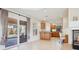 Open kitchen area with backyard view and access, oak cabinets and tiled floors at 10948 Carberry Hill St, Las Vegas, NV 89141