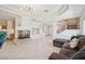 Inviting living room with fireplace, tiled floors, and staircase leading to the second floor at 10948 Carberry Hill St, Las Vegas, NV 89141