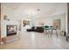 Spacious living area with fireplace, comfortable seating, and dining area at 10948 Carberry Hill St, Las Vegas, NV 89141