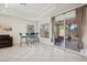 Bright room with breakfast nook, backyard access, and ample natural light at 10948 Carberry Hill St, Las Vegas, NV 89141