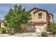 Charming two-story home featuring a well-maintained front yard and attached two-car garage at 11177 Deluna St, Las Vegas, NV 89141