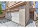 Attached two-car garage featuring new white door at 11177 Deluna St, Las Vegas, NV 89141