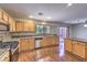 Spacious kitchen featuring wood cabinets, granite countertops, and stainless steel appliances, perfect for cooking and entertaining at 11177 Deluna St, Las Vegas, NV 89141