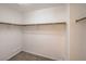 Walk-in closet with wrapped shelving and carpeted floor at 11177 Deluna St, Las Vegas, NV 89141