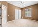 Neutral bedroom with a ceiling fan, window with blinds, and closet at 11177 Twilight Times Ct, Las Vegas, NV 89135