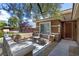 Cozy front porch area with seating, stone accents, and manicured landscaping, creating a welcoming entrance at 11177 Twilight Times Ct, Las Vegas, NV 89135