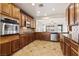 Modern kitchen showcasing granite countertops, stainless steel appliances, and abundant cabinet space for culinary enthusiasts at 11177 Twilight Times Ct, Las Vegas, NV 89135