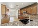 Well-appointed kitchen featuring granite countertops, stainless steel appliances, and ample cabinet space for storage at 11177 Twilight Times Ct, Las Vegas, NV 89135